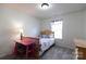 Cozy bedroom with gray carpet, a pink desk, and a window at 159 Saye Pl, Mooresville, NC 28115