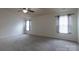 Neutral bedroom with carpet, two windows, and a ceiling fan at 159 Saye Pl, Mooresville, NC 28115