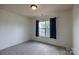 Bedroom featuring carpet floors, neutral walls, and a window with curtains at 159 Saye Pl, Mooresville, NC 28115