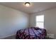 The bedroom features soft carpet, a bright window, and ample space at 159 Saye Pl, Mooresville, NC 28115