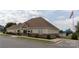 Community clubhouse featuring landscaped grounds and ample parking at 159 Saye Pl, Mooresville, NC 28115