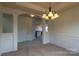 Elegant dining room with decorative columns, wainscoting, and a stylish chandelier for sophisticated meals at 159 Saye Pl, Mooresville, NC 28115