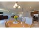 Dining room showing open floor plan with views to kitchen and living room at 159 Saye Pl, Mooresville, NC 28115