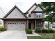 Charming two-story home with a brick facade, manicured landscaping, and a spacious two-car garage at 159 Saye Pl, Mooresville, NC 28115
