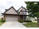 Charming two-story home featuring a brick and siding exterior, well-maintained lawn, and a two-car garage at 159 Saye Pl, Mooresville, NC 28115