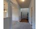 Welcoming foyer featuring detailed trim work, archways, carpet, and hardwood floors that offer a sense of arrival at 159 Saye Pl, Mooresville, NC 28115