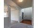 Bright foyer with hardwood accents and arched doorways creates an elegant entry at 159 Saye Pl, Mooresville, NC 28115