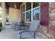 Comfortable front porch seating with brick accents, offering a relaxing spot to enjoy the outdoors at 159 Saye Pl, Mooresville, NC 28115