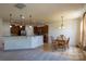 Open-concept kitchen and dining area with stainless steel appliances and a breakfast bar, ideal for entertaining at 159 Saye Pl, Mooresville, NC 28115