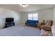 This room is staged with a TV, sofa, and comfortable seating at 159 Saye Pl, Mooresville, NC 28115
