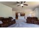Spacious living room with neutral walls, ceiling fan, and views to the kitchen and dining room at 159 Saye Pl, Mooresville, NC 28115
