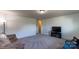 A spacious living room is staged with a television and a comfortable sofa at 159 Saye Pl, Mooresville, NC 28115