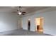 Main bedroom with ensuite bathroom, ceiling fan, carpet, and walk in closet at 159 Saye Pl, Mooresville, NC 28115