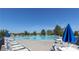 Large community swimming pool with plenty of lounge chairs and umbrellas for residents at 159 Saye Pl, Mooresville, NC 28115