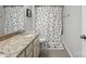 Bathroom featuring a vanity with granite counters and a shower with patterned curtain at 16114 Foreleigh Rd, Huntersville, NC 28078