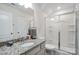 Bathroom featuring a vanity with granite counters and a glass-enclosed shower at 16114 Foreleigh Rd, Huntersville, NC 28078