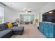 Spacious bonus room with ample natural light and a ceiling fan for added comfort at 16114 Foreleigh Rd, Huntersville, NC 28078