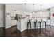 This spacious kitchen offers an island with seating, granite countertops, and ample cabinet space at 16114 Foreleigh Rd, Huntersville, NC 28078