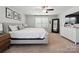 Spacious main bedroom with a large window, a ceiling fan, and neutral décor at 16114 Foreleigh Rd, Huntersville, NC 28078
