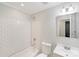 Bathroom featuring a shower-tub, vanity with a sink, modern mirror and white subway tile at 2001 Tyvola Rd, Charlotte, NC 28210