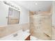 Updated bathroom featuring a tiled shower with glass doors, a vanity with a sink, and a modern mirror at 2001 Tyvola Rd, Charlotte, NC 28210
