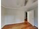 Spacious bedroom with hardwood floors and neutral paint at 2001 Tyvola Rd, Charlotte, NC 28210