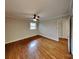 Bright bedroom featuring hardwood floors and a ceiling fan at 2001 Tyvola Rd, Charlotte, NC 28210