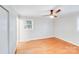 Bright bedroom featuring hardwood floors, a large window for natural light and neutral paint at 2001 Tyvola Rd, Charlotte, NC 28210