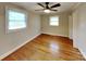 Bedroom with hardwood floors, ceiling fan and natural light at 2001 Tyvola Rd, Charlotte, NC 28210