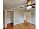 Bedroom with hardwood flooring, closet, and neutral paint at 2001 Tyvola Rd, Charlotte, NC 28210