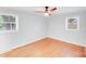 Bright bedroom featuring hardwood floors, two large windows for natural light and neutral paint at 2001 Tyvola Rd, Charlotte, NC 28210