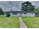 Charming single-story home with a well-manicured lawn and inviting front entrance at 2001 Tyvola Rd, Charlotte, NC 28210
