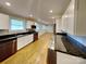 Stylish kitchen featuring stainless steel appliances, modern cabinetry, and granite countertops at 2001 Tyvola Rd, Charlotte, NC 28210