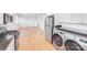 Modern kitchen featuring stainless steel appliances including a washer and dryer combo at 2001 Tyvola Rd, Charlotte, NC 28210