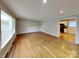 Bright living room featuring gleaming hardwood floors and fresh paint at 2001 Tyvola Rd, Charlotte, NC 28210
