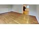 Bright living room featuring gleaming hardwood floors and fresh paint at 2001 Tyvola Rd, Charlotte, NC 28210