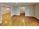 Spacious living room featuring hardwood floors and neutral paint at 2001 Tyvola Rd, Charlotte, NC 28210