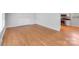 Open living room with hardwood floors flowing seamlessly into the updated kitchen at 2001 Tyvola Rd, Charlotte, NC 28210