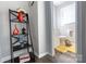 Bright bathroom with a decorative shelving unit and a toilet with white vanity at 2012 Double Oaks Rd, Charlotte, NC 28206