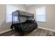 Bedroom features a sturdy bunk bed frame with comfortable mattresses and stylish dark bedding at 2012 Double Oaks Rd, Charlotte, NC 28206