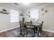 Charming dining area with a modern table set, sleek wood flooring, and decorative wall accents at 2012 Double Oaks Rd, Charlotte, NC 28206