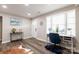 Inviting living room entry space featuring a desk, wood-look floors, and a view of the home's entrance at 2012 Double Oaks Rd, Charlotte, NC 28206