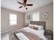 Comfortable bedroom featuring a ceiling fan, natural light, and stylish decor for a relaxing atmosphere at 2123 W Sixth Ave, Gastonia, NC 28052