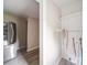 Bright laundry room with white walls, modern flooring, and ample shelving for storage at 2123 W Sixth Ave, Gastonia, NC 28052