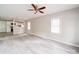 Open living space featuring light walls, modern flooring, and a view into the kitchen area at 2123 W Sixth Ave, Gastonia, NC 28052