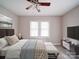 Comfortable main bedroom with a bed, matching furniture, two windows, and wood-look flooring create a serene retreat at 2123 W Sixth Ave, Gastonia, NC 28052