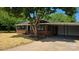 Charming brick home with a carport and front yard featuring newly laid straw at 2203 Arney St, Lincolnton, NC 28092