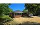Charming brick home with black framed windows and a well-maintained lawn at 2203 Arney St, Lincolnton, NC 28092