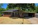 Charming brick home with black framed windows and carport at 2203 Arney St, Lincolnton, NC 28092