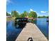 This property features a private dock with a covered boat slip, perfect for enjoying waterfront living at 221 Stillwater Rd, Troutman, NC 28166